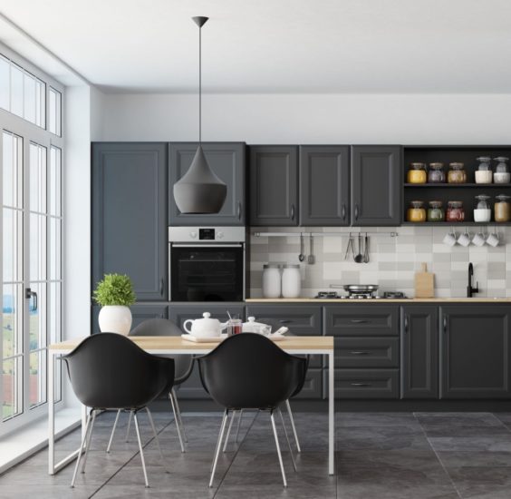 Trendy Scandinavian open concept kitchen and dining room with lots of natural light.
Functional, modern and bright one wall kitchen with black and wooden cabinets.
Wooden dining table and black modern chairs are placed next to a big panoramic windows. 
Vintage, big, lighting fixture. Dark rustic stone tile flooring. Summer scene.

++ background is my photo.