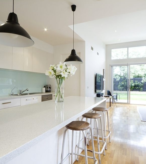 Contemporary kitchen and open plan living room with garden aspect