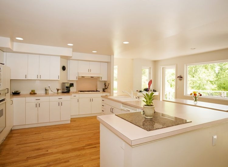 Photo of a spacious modern kitchen with lots of natural light. Photo of a spacious modern kitchen with lots of natural light.